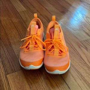 Orange adidas training sneakers
